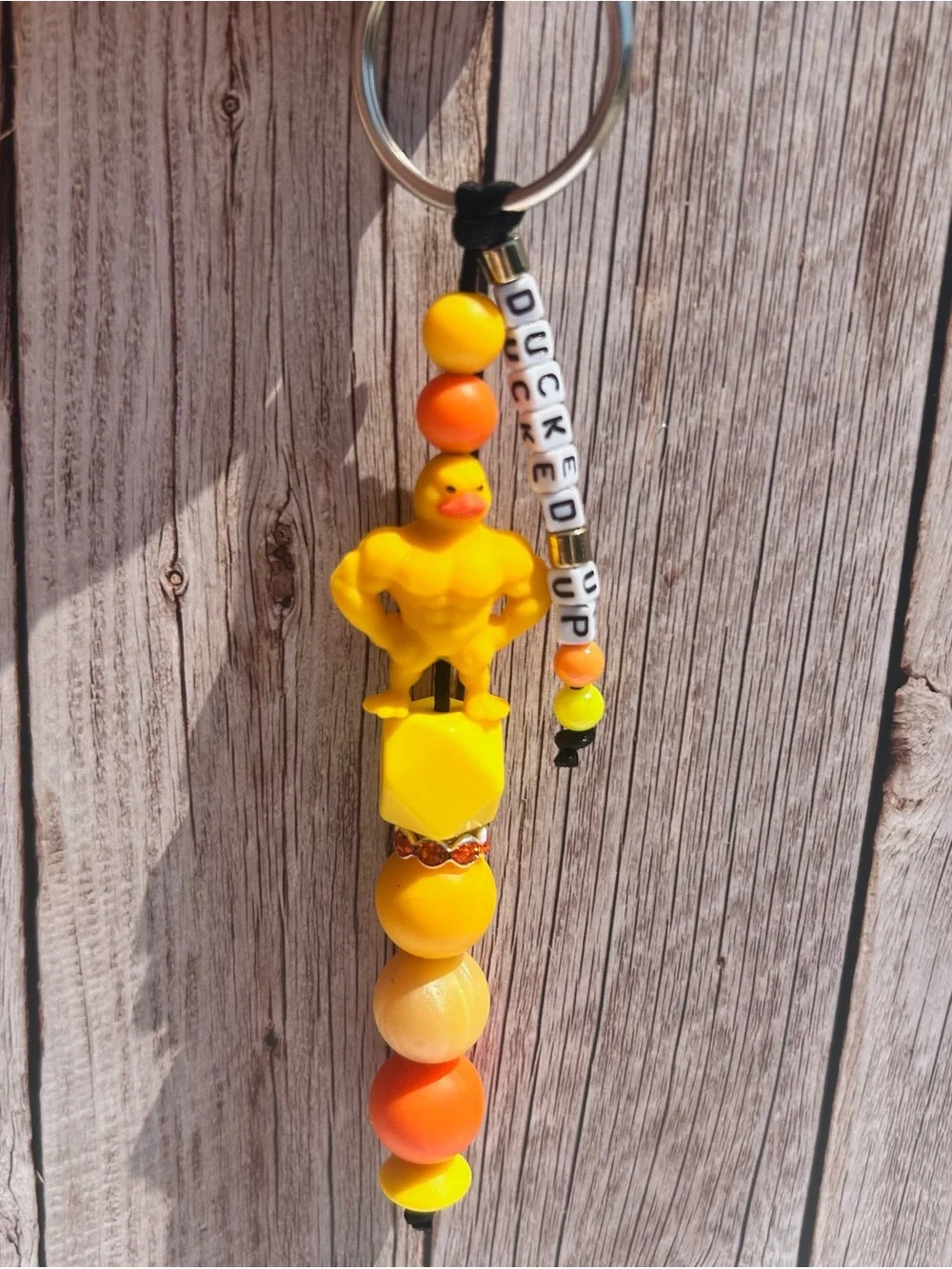 Yellow Muscular Rubber Duck Keychain with handmade letter bead strand